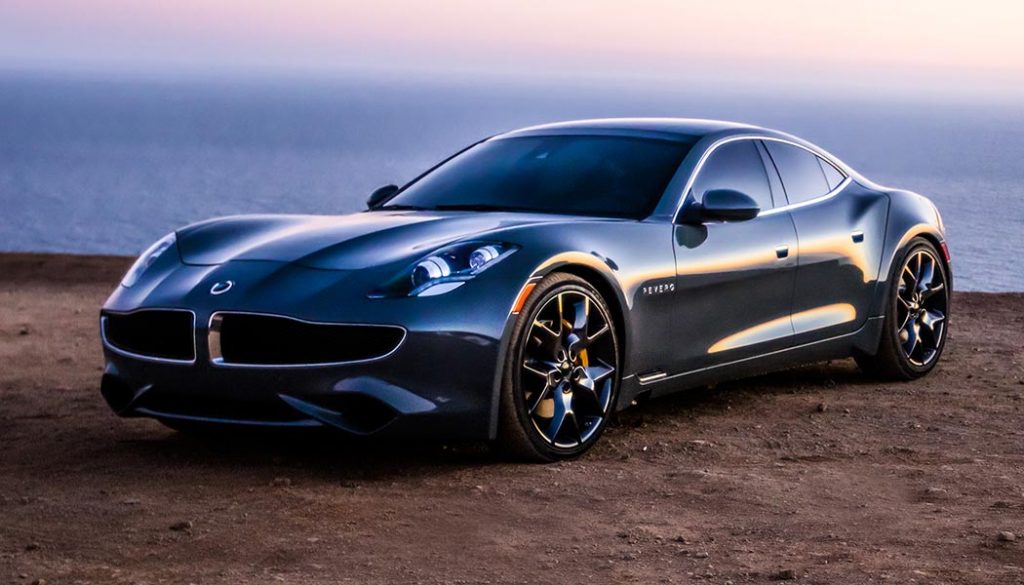 A red Karma Revero with solar panels on the roof